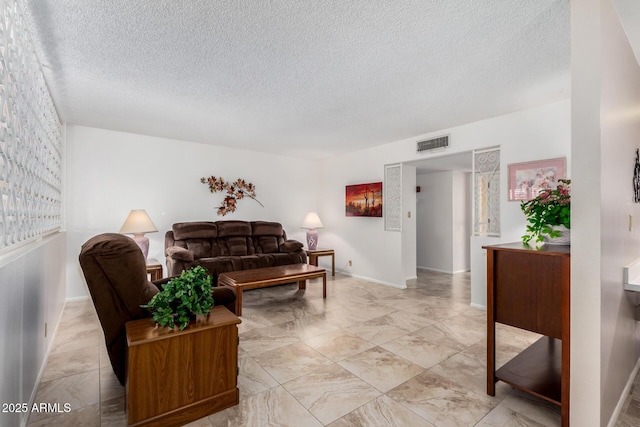 living room featuring a textured ceiling