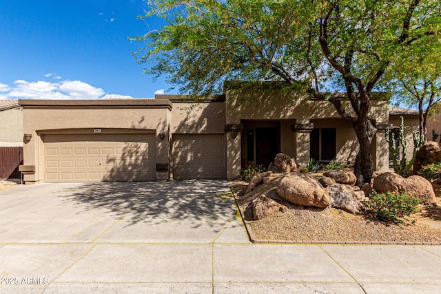 25845 N 44th Ave, Phoenix, AZ 85083 - southwest-style home with concrete driveway, a garage, and stucco siding