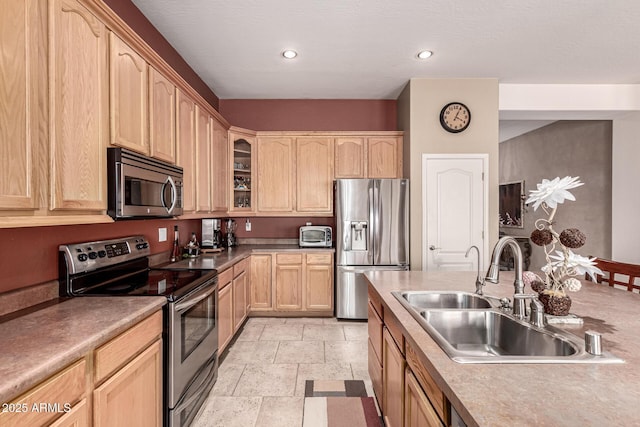 25845 N 44th Ave, Phoenix, AZ 85083 - kitchen with a sink, glass insert cabinets, light brown cabinets, stainless steel appliances, and stone tile floors