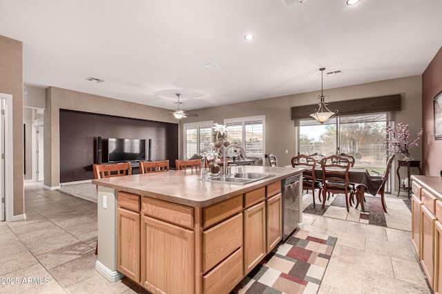 25845 N 44th Ave, Phoenix, AZ 85083 - kitchen with light brown cabinetry, a sink, stainless steel dishwasher, visible vents, and a center island with sink