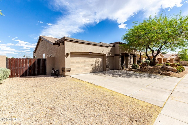 25845 N 44th Ave, Phoenix, AZ 85083 - view of front facade with fence, a garage, driveway, and stucco siding