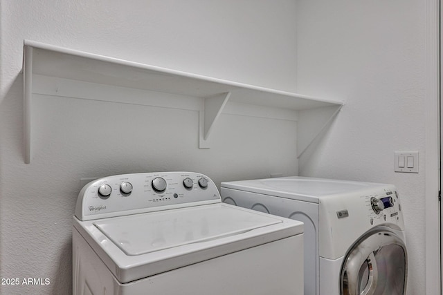 clothes washing area with laundry area and independent washer and dryer