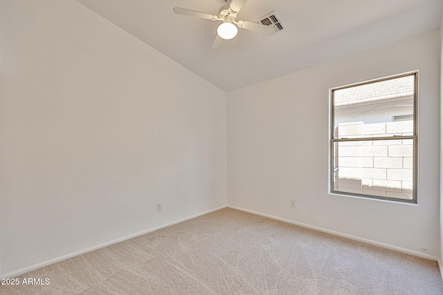 unfurnished room with baseboards, lofted ceiling, light colored carpet, and ceiling fan