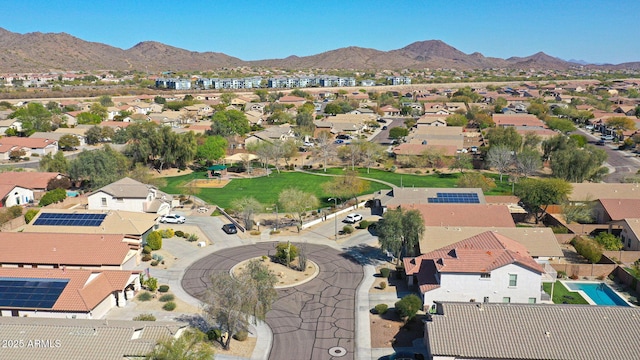 birds eye view of property with a mountain view and a residential view