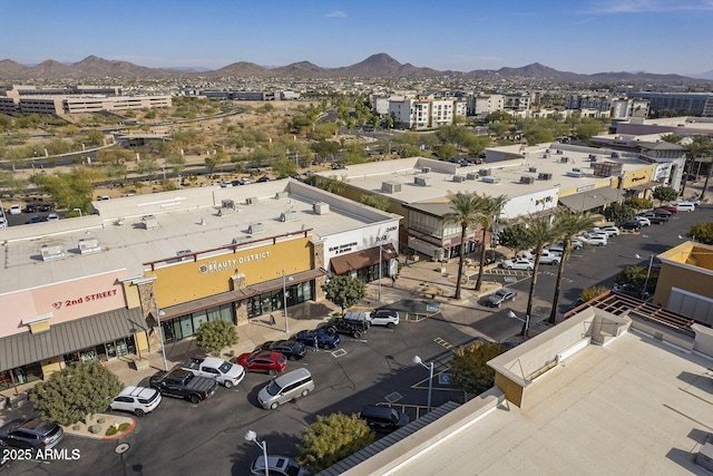 birds eye view of property featuring a mountain view