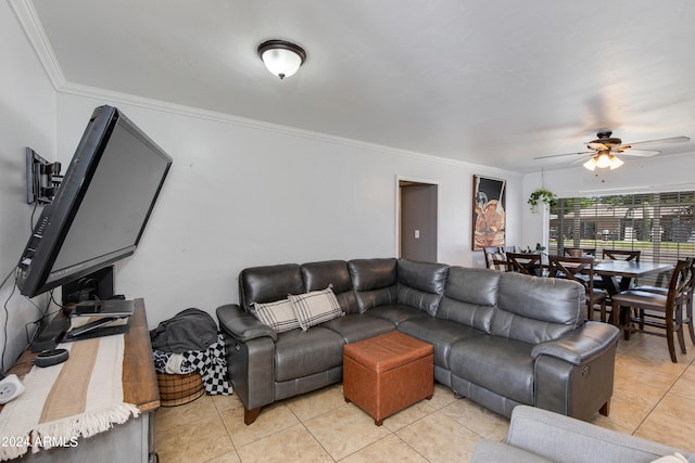 tiled living room with crown molding and ceiling fan