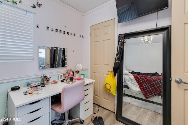 7830 N 17th Ave, Phoenix, AZ 85021 - home office featuring light wood-type flooring, a chandelier, and ornamental molding