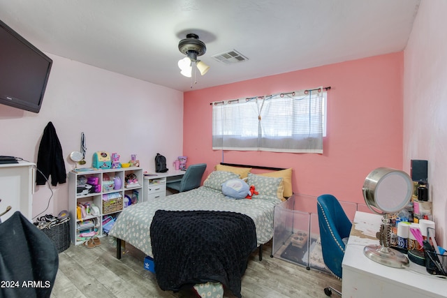 bedroom with ceiling fan and light wood-type flooring