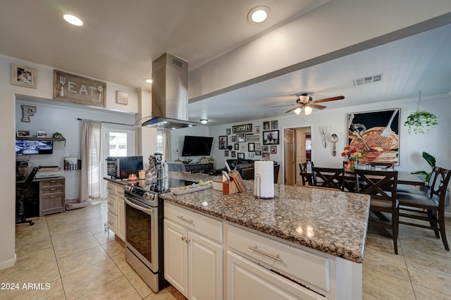 kitchen featuring island exhaust hood, stone countertops, stainless steel range with electric cooktop, and a kitchen island