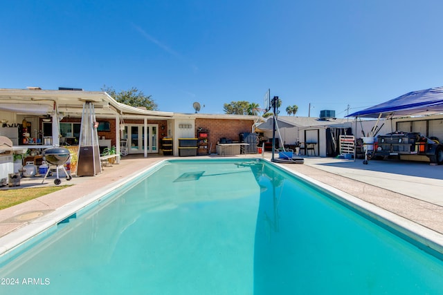 view of pool featuring a patio