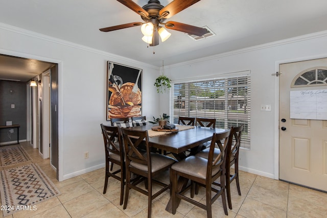 7830 N 17th Ave, Phoenix, AZ 85021 - dining space with light tile patterned flooring, ornamental molding, a ceiling fan, and baseboards
