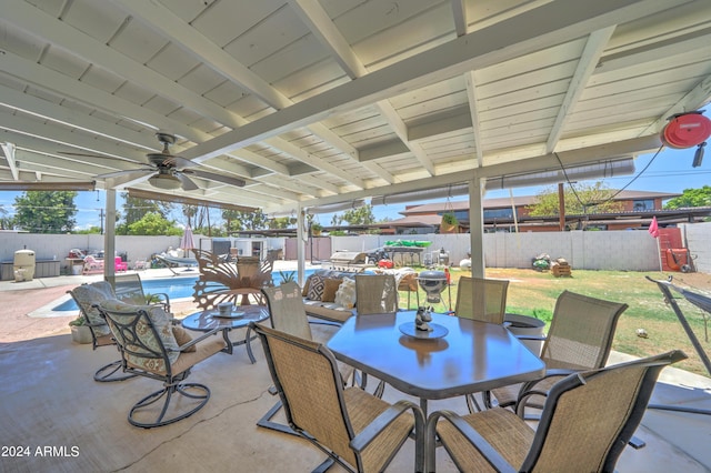 view of patio featuring ceiling fan and a fenced in pool