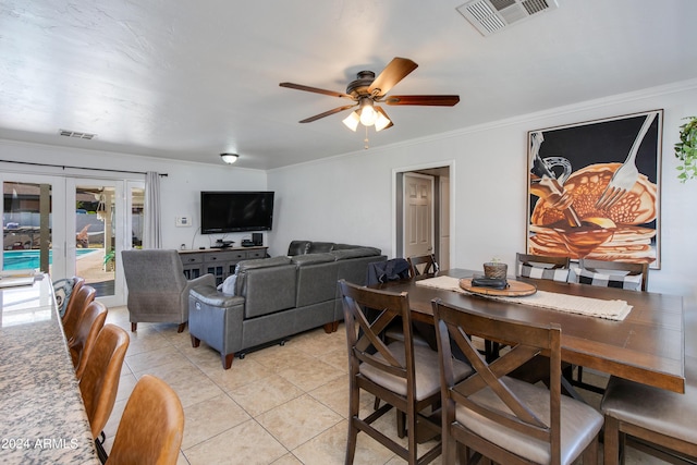 7830 N 17th Ave, Phoenix, AZ 85021 - dining area with french doors, light tile patterned floors, a ceiling fan, and crown molding