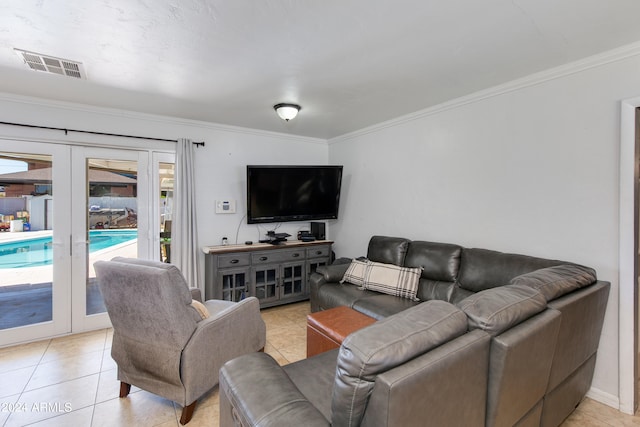 tiled living room with french doors and crown molding