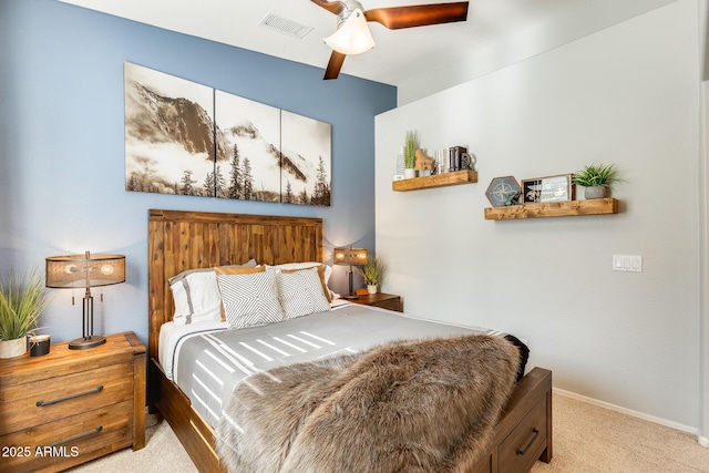 carpeted bedroom featuring visible vents, baseboards, and a ceiling fan