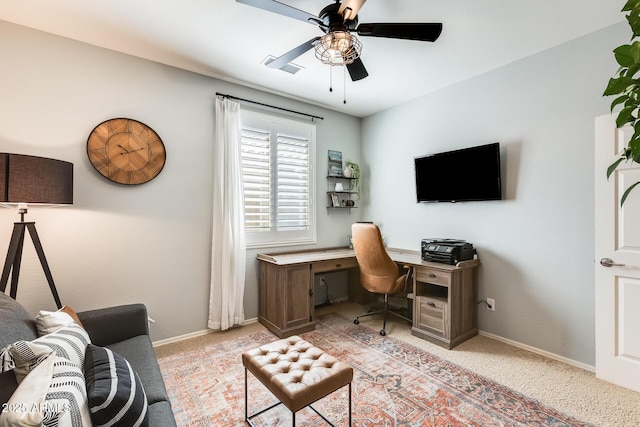 office with light carpet, ceiling fan, baseboards, and visible vents