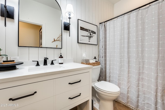 bathroom with tile patterned flooring, vanity, a shower with curtain, and toilet