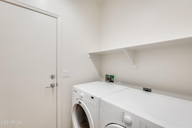 laundry room featuring washer and dryer and laundry area