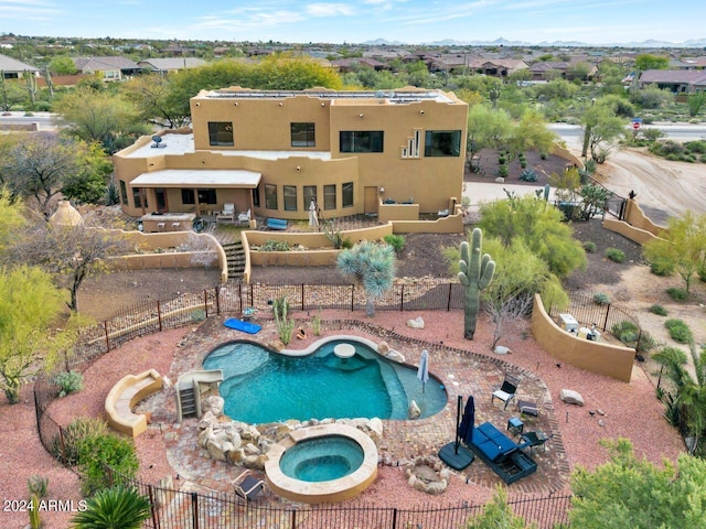 view of pool featuring an in ground hot tub and a patio area