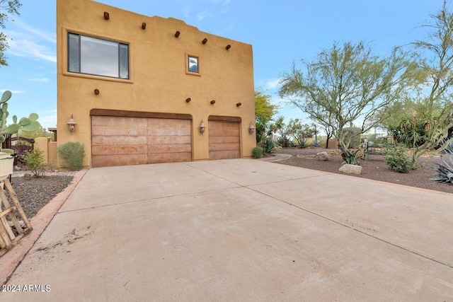 view of property exterior with a garage