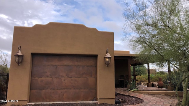 southwest-style home with a garage