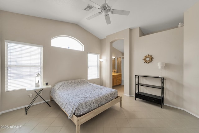 2221 E Union Hills Dr Unit 148, Phoenix, AZ 85024 - bedroom with lofted ceiling, arched walkways, baseboards, and a ceiling fan