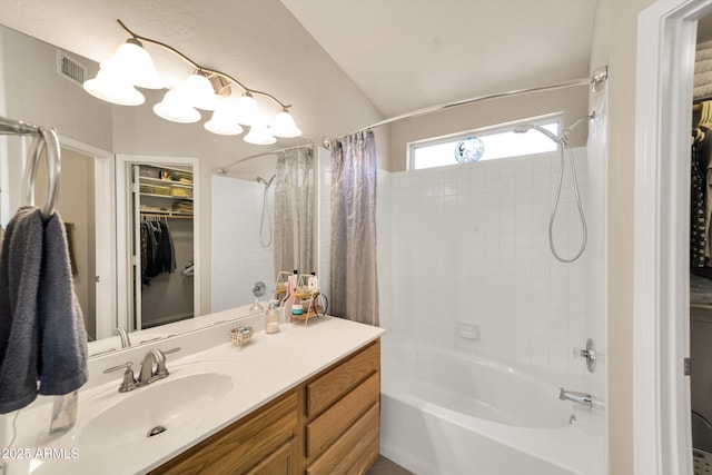 2221 E Union Hills Dr Unit 148, Phoenix, AZ 85024 - full bathroom featuring shower / bath combo, vanity, a walk in closet, and vaulted ceiling