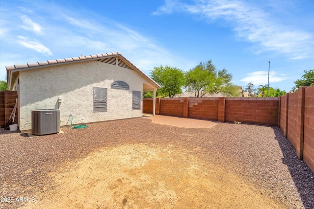 2221 E Union Hills Dr Unit 148, Phoenix, AZ 85024 - view of home's exterior featuring central AC, stucco siding, and a fenced backyard