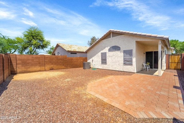 2221 E Union Hills Dr Unit 148, Phoenix, AZ 85024 - rear view of house with stucco siding, a fenced backyard, and a patio