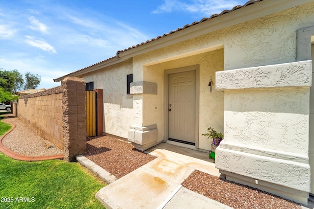 2221 E Union Hills Dr Unit 148, Phoenix, AZ 85024 - doorway to property featuring stucco siding, a gate, and a tiled roof