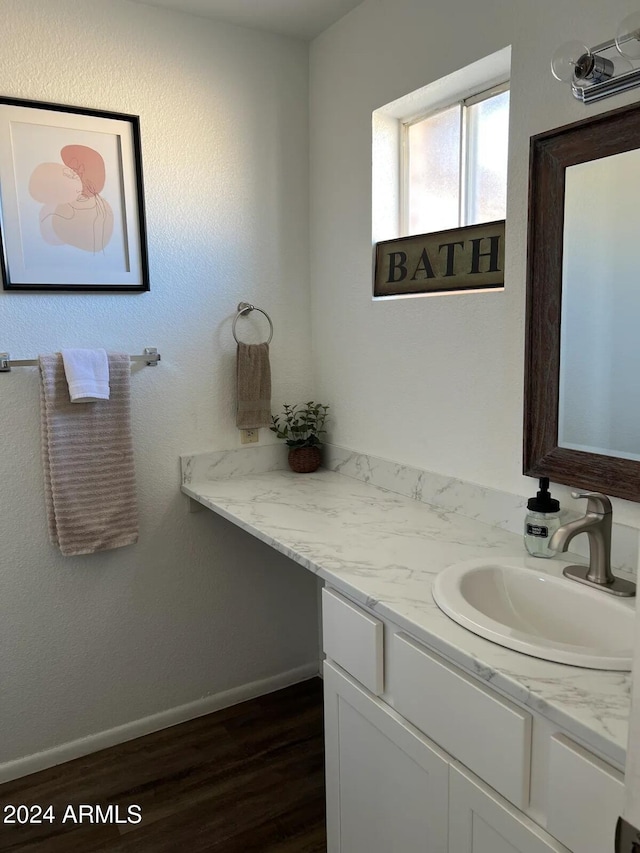 bathroom with wood-type flooring and vanity