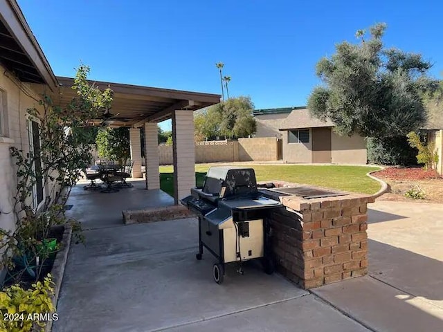 view of patio / terrace featuring ceiling fan