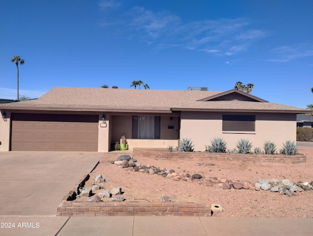 single story home with a garage