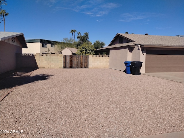 view of yard featuring a garage