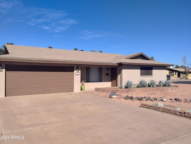 ranch-style home with a garage