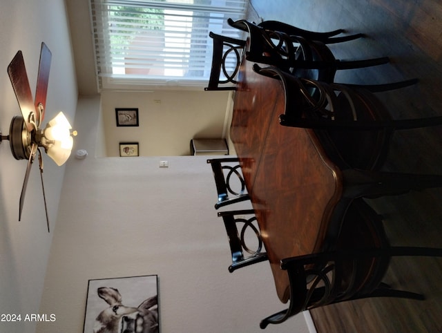 dining space with hardwood / wood-style flooring