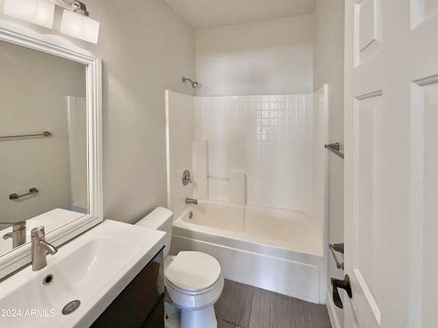 full bathroom featuring shower / tub combination, vanity, and toilet