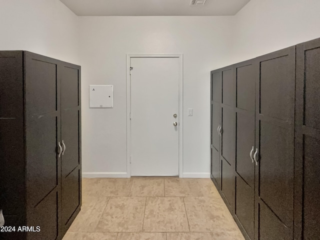 interior space with light tile patterned floors