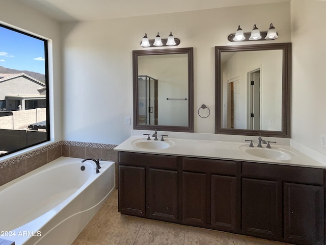 bathroom with vanity, separate shower and tub, and tile patterned floors