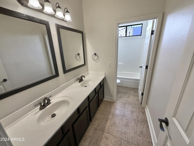 full bathroom with bathing tub / shower combination, vanity, toilet, and tile patterned floors