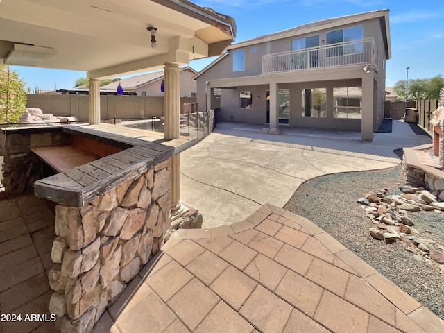 view of patio with a balcony