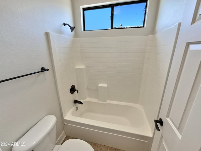 bathroom with shower / washtub combination and toilet