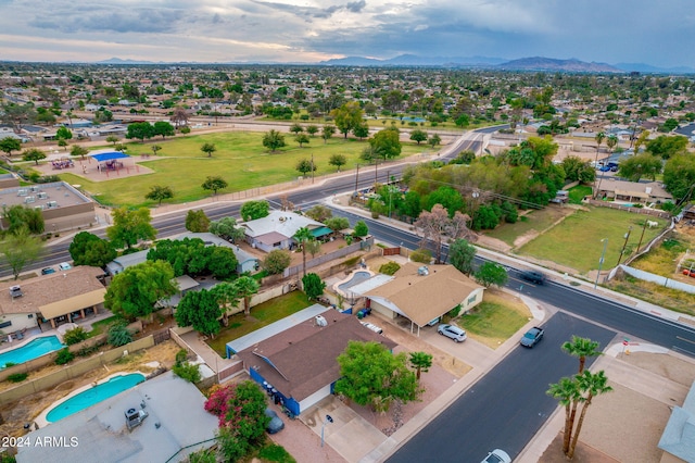 birds eye view of property featuring a mountain view