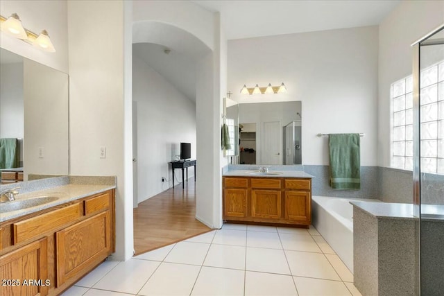 bathroom with vanity, separate shower and tub, and tile patterned flooring