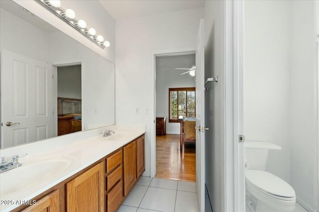 bathroom with vanity, tile patterned floors, ceiling fan, and toilet