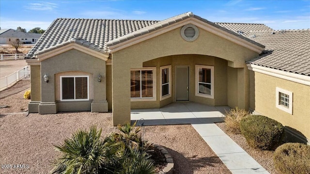 back of house with a patio