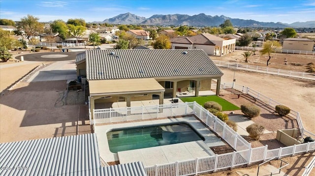 view of swimming pool featuring a mountain view and a patio area