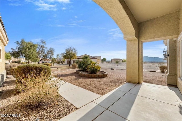 view of yard with a mountain view and a patio area