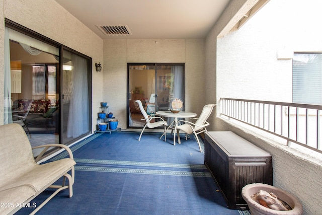 balcony featuring visible vents