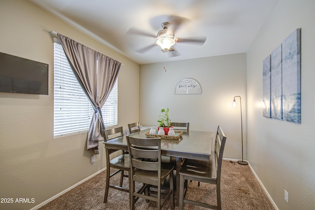 dining space with carpet flooring, ceiling fan, and baseboards